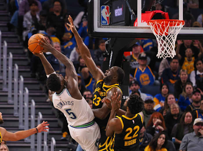 Nov 12, 2023; San Francisco, California, USA; Minnesota Timberwolves guard Anthony Edwards (5) shoots the ball agsint Golden State Warriors forward Draymond Green (23) during the fourth quarter at Chase Center.